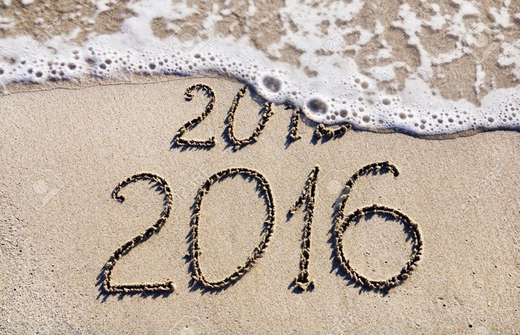 24917287-Happy-New-Year-2016-replace-2015-concept-on-the-sea-beach-Stock-Photo