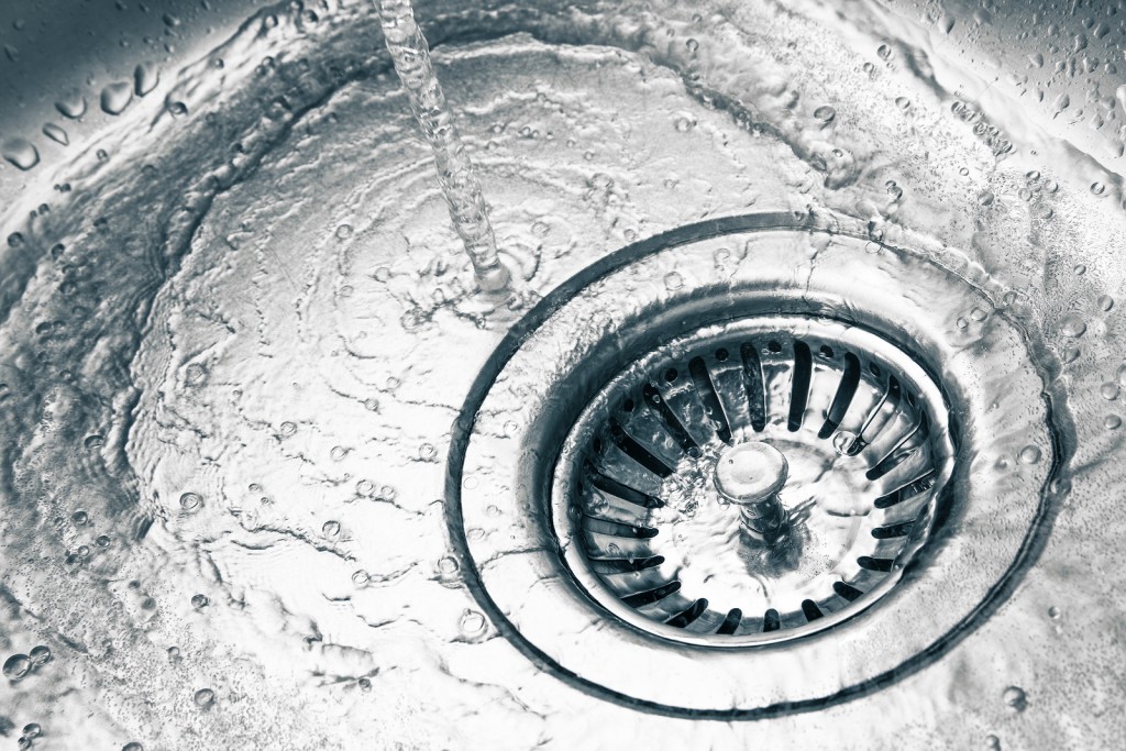 a stainless steel kitchen sink drain detail